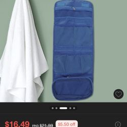 blue hanging travel toiletry bag with a clear internal compartment/ and zipper bags