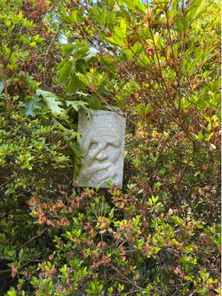 Peeping Tom concrete plaque