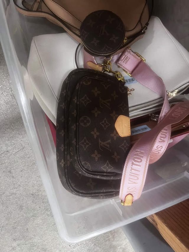 Authentic Louis Vuitton Multi Pochette Accessoires with pink strap.