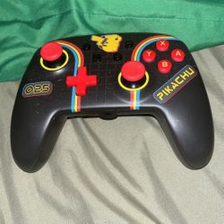black, and red nintendo controller 