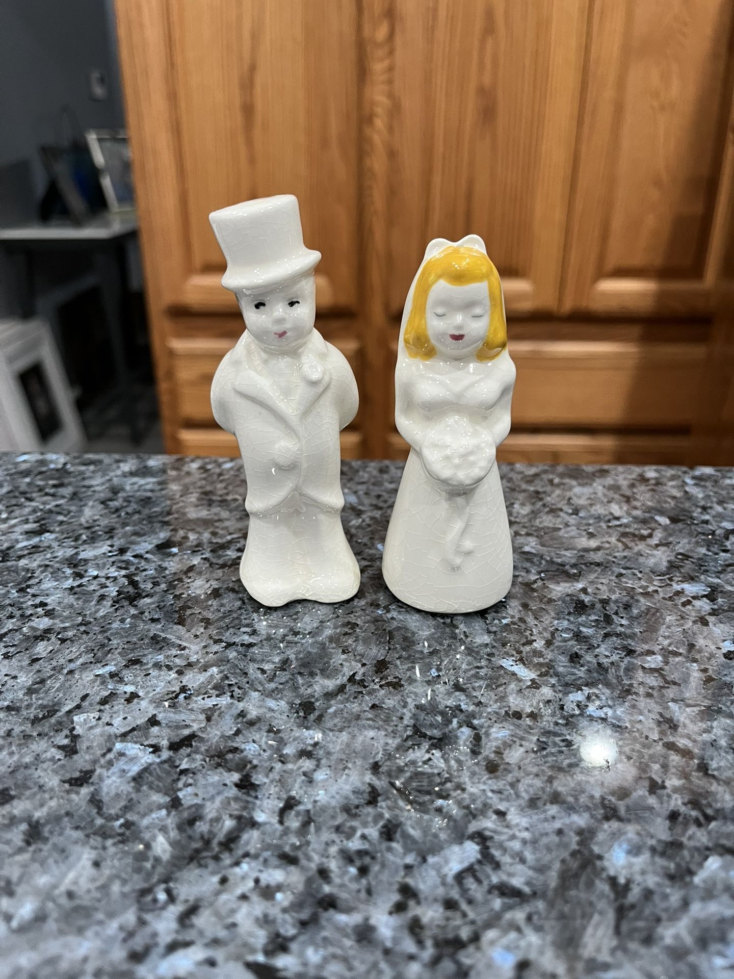 Vintage Mid century, bride and groom, salt and pepper shakers. Size approximately bride 3 3/4 inches tall and Groom 4 1/4 inches tall. Preowned