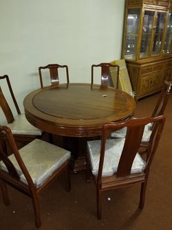Chinese hard wood round table with 6 chairs.