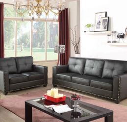 Black leather couch and love seat