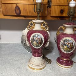 Vintage The item is an antique hand-painted porcelain lamp, likely dating back to the mid-20th century. It features a Rococo-style design with a centr