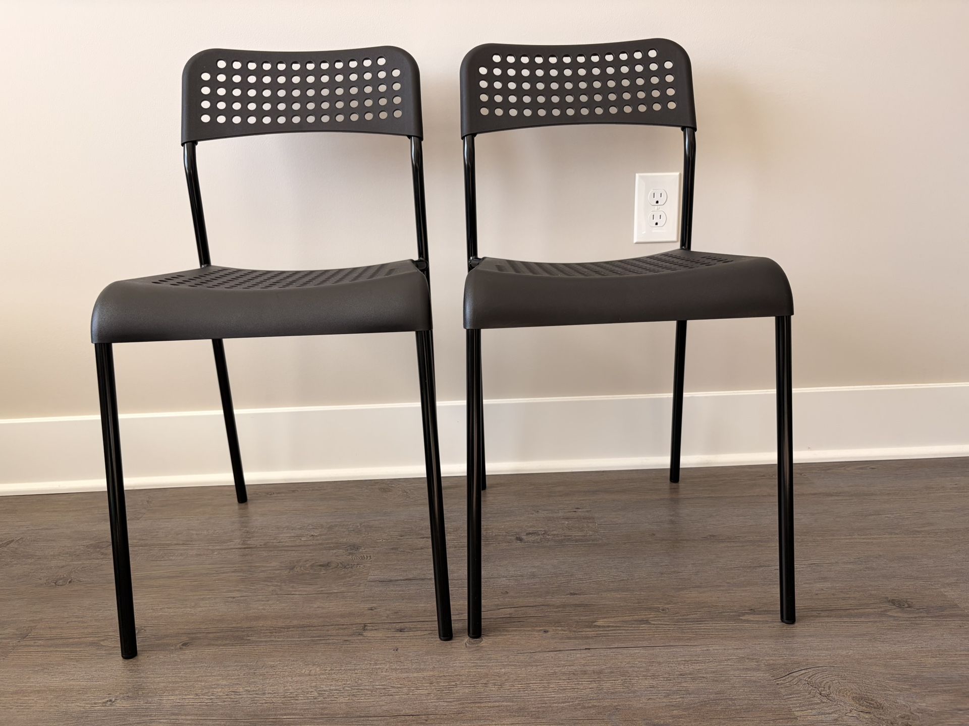 IKEA ADDE chair in black with a steel frame and polypropylene seat and back.  