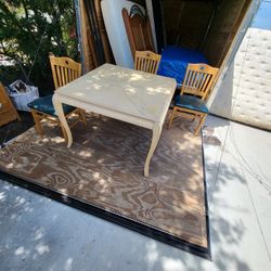 Dining room table and three chairs