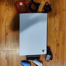 Complete PS5 set with extra controller, 2TB SSD, charging station, & 12  games