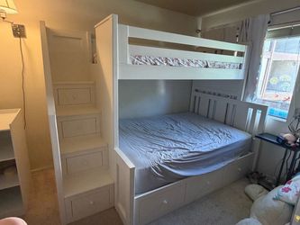 Twin over full bunk bed with storage drawers and staircase