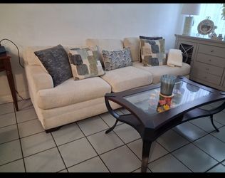 Beautiful sofa. and love seat with cushions  + coffee table