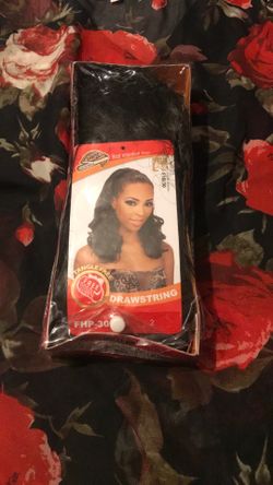 It is a dark brown ponytail