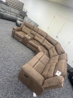 Brand new suede L-shape sectional with recliner on both ends w/storage space and cup holders