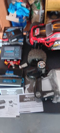Rival monster truck with remote and extra battery and charger. Also some tools.