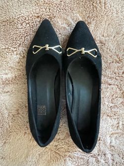 Black pointed toe flats with small heel