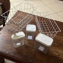 Two Wire Storage Baskets And Three Plastic Airtight Storage Containers 