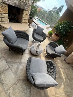 Outdoor patio set with raw teak table