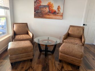 Authentic leather chairs and glass coffee table