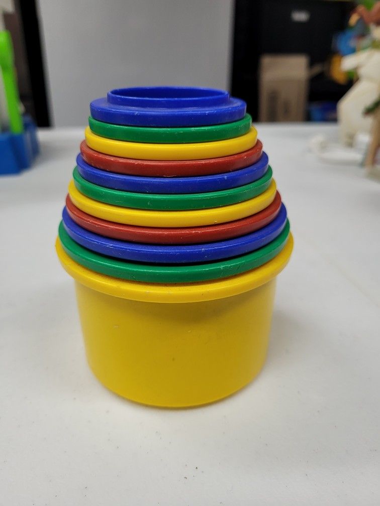 Complete set of 12 Stacking/ Nesting CupsVintage Discovery Toys made in 1984Number stickers on outside $10
