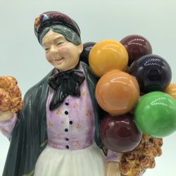 Royal Doulton NH 1843 “Biddy Penny Farthing” Figurine