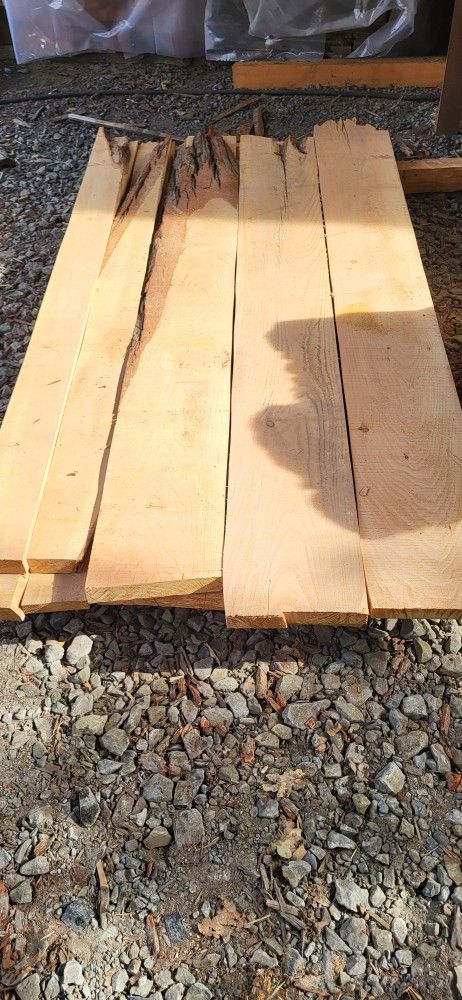 Incense cedar 2x12x8 wany garden boards.  Price is per board. A few 2x6's.  Sold as-is.