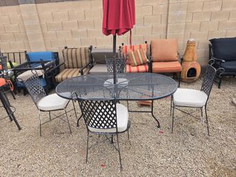 $300  IRON PATIO SET 4 CHAIRS AND BIG OVAL TABLE