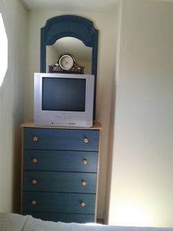 Beautiful bedroom dresser with TV and clock