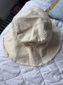 Never worn cream bucket hat with frayed edges