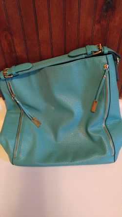 Turquoise leather bag , exspandable side pockets