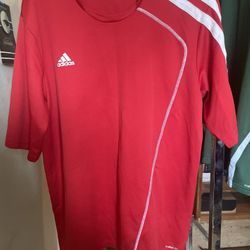 Red Adidas Shirt with White Stripes on Left Side