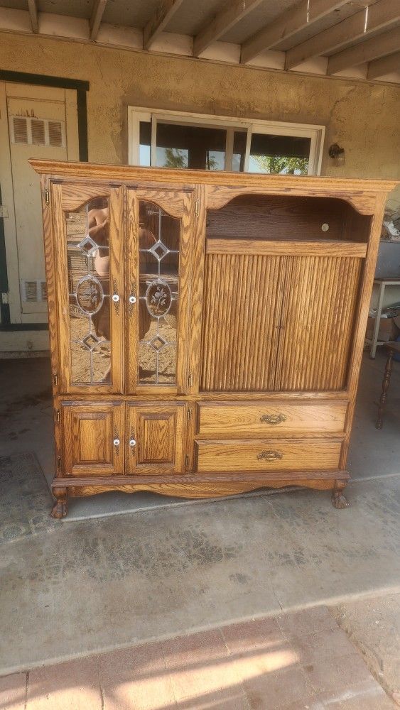 Old entertainment center and there old dresser