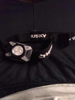 This is a Husky 500-lumens dual beam LED headlamp with 5 light modes and an adjustable head strap.This headlamp offers 5 modes, including high, low, r