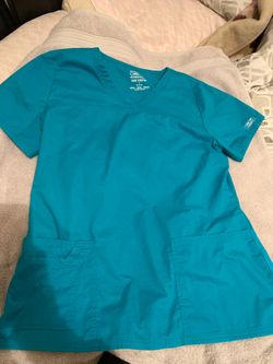 Teal Scrubs and Black Pants