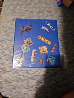 Binder Full Of "Dragon Ball Z" Cards And "Mega Man" Card".