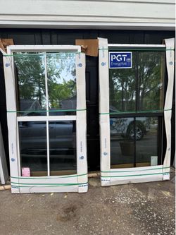 (2) PGT 3060 single hung Impact rated windows.