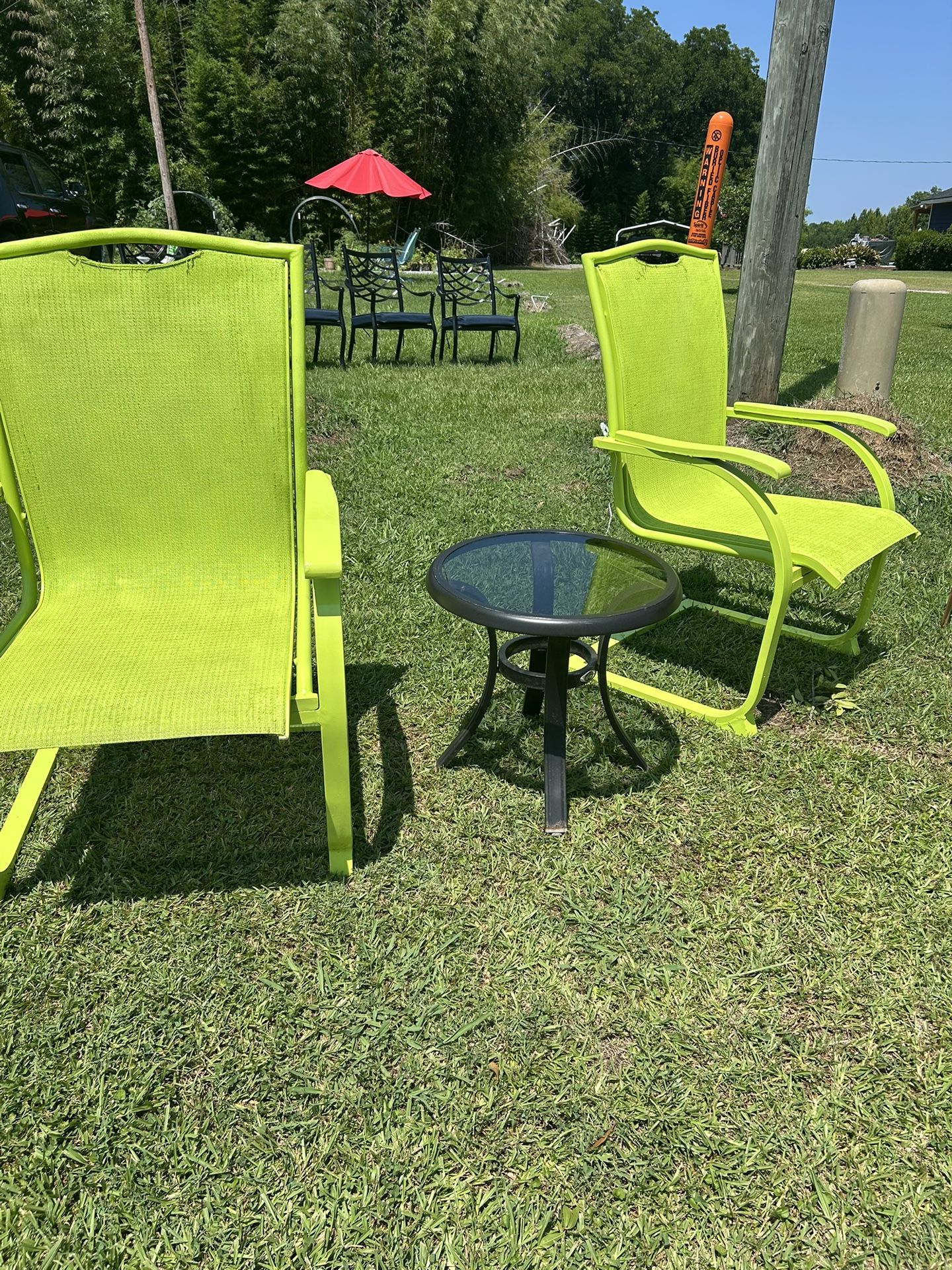 Two Green Outdoor Chairs With Table 