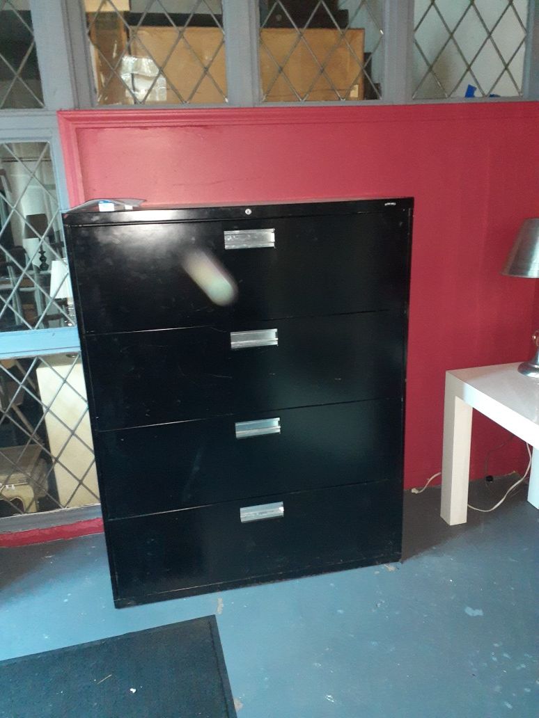 Large 4 drawer file cabinet.