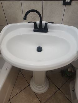 Bathroom sink and stand.