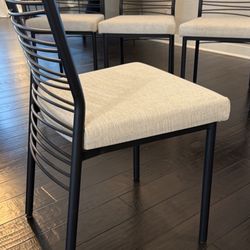 Set of 8 Dining Chairs — Black Metal Frame, Cream Upholstered Seat
