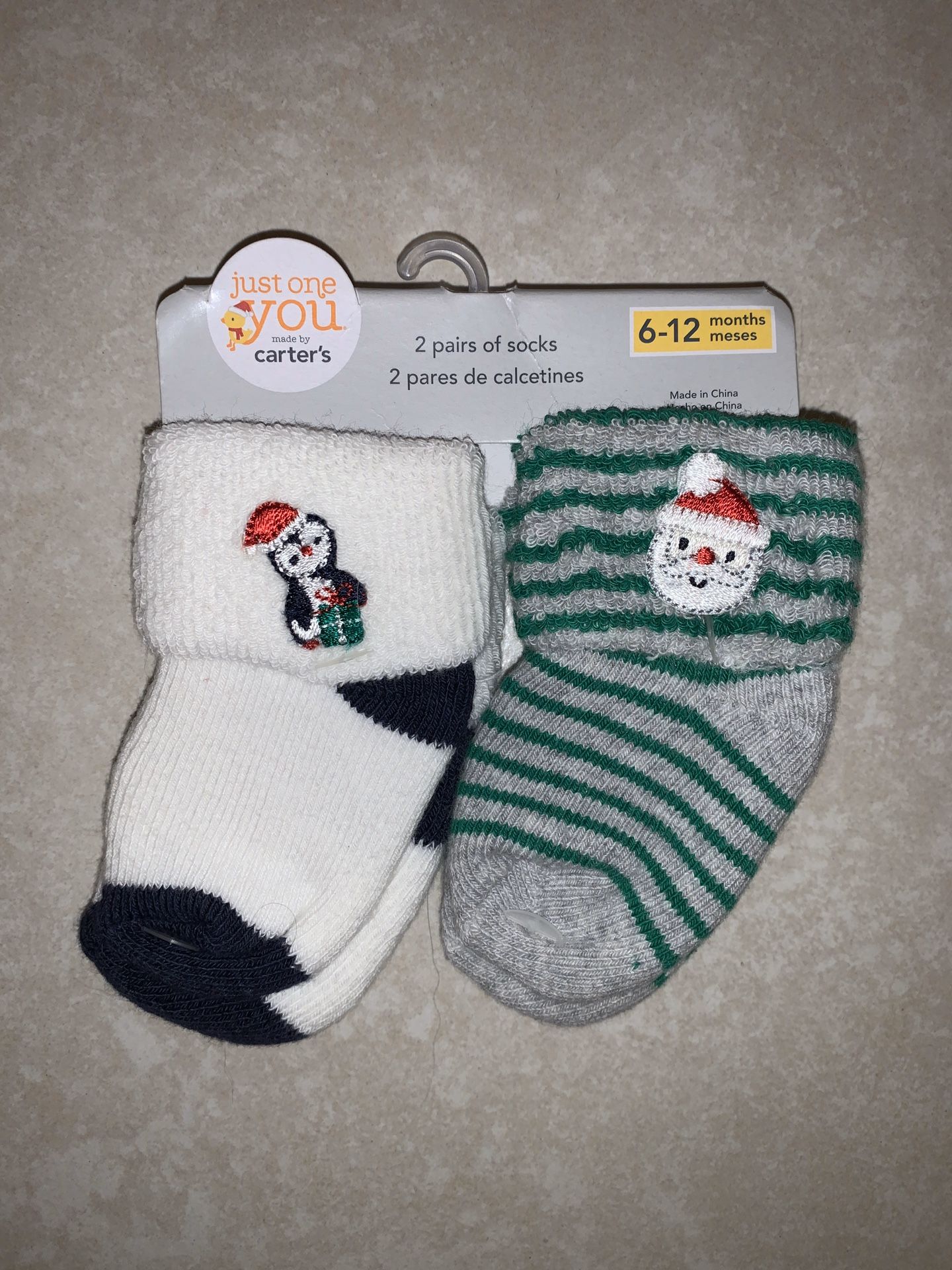 2 Brand new Carter’s christmas socks, size 6-12 months