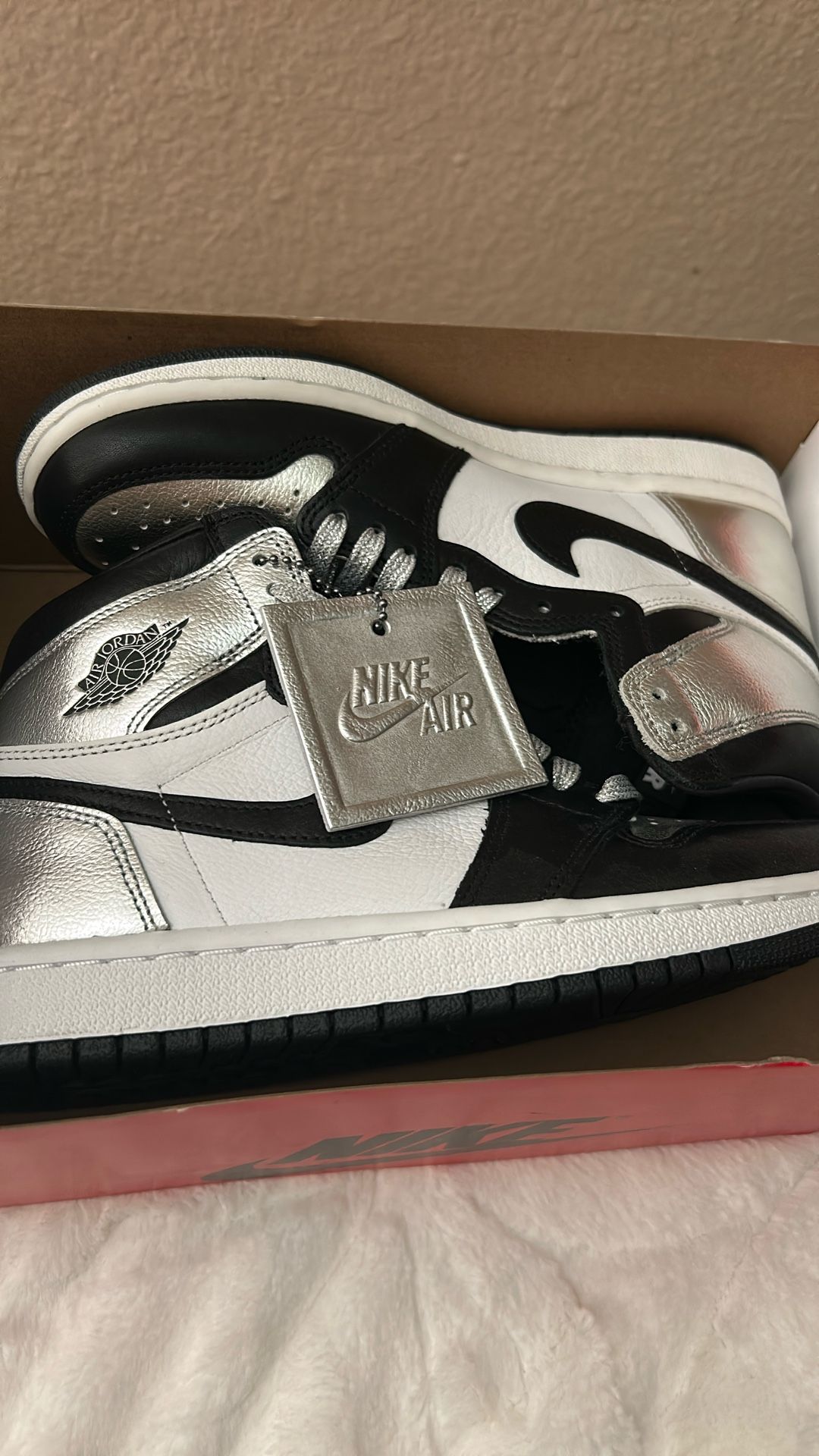 Brand New Silver High Top Jordans.