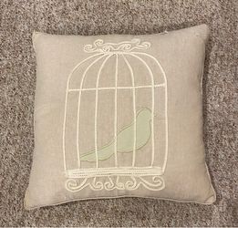 Decorative feather pillow, bird in cage design