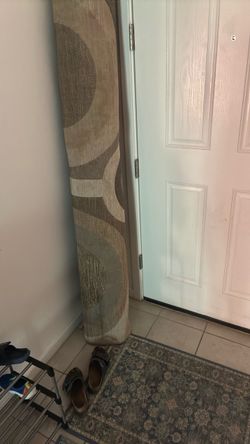 7x9 Area Rug Rolled Up – Neutral Geometric Pattern