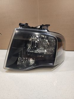 OEM 2007-2014 Ford Expedition Black Headlight Driver Side