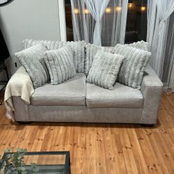 Soft grey faux fur modern Sofa .  Plush and less than 1 & Half Used 