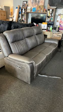 New floor model grey super comfy gel sofa couch power recliner only. Last one was $1499 now on sale