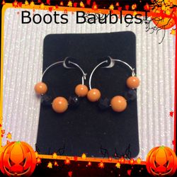 Orange and black silver tone hoop earrings