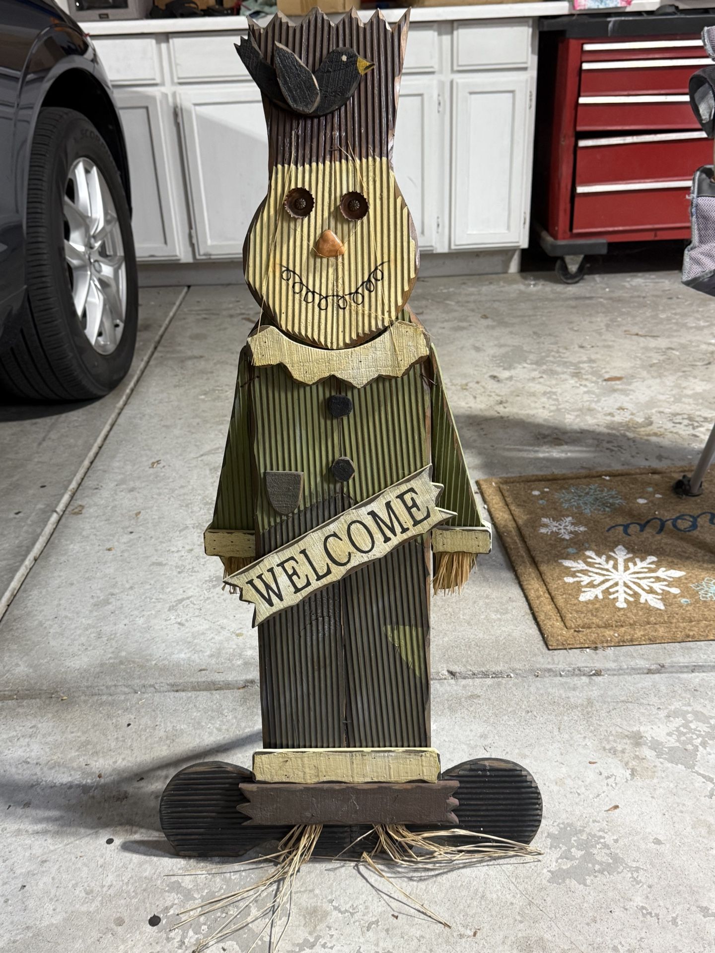 Wooden Scarecrow With Welcome Sign