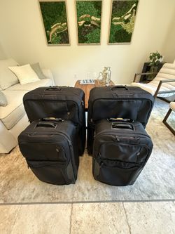 Tumi four piece Suitcase/luggage Travel set, two carry on bags and two large checked bags. Suitcases. 