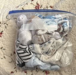 Bag Full Of Newborn Boy Socks And Caps