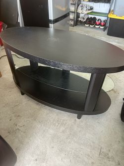 Black coffee table with glass middle section