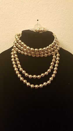 Beautiful gold choker necklace and earrings
